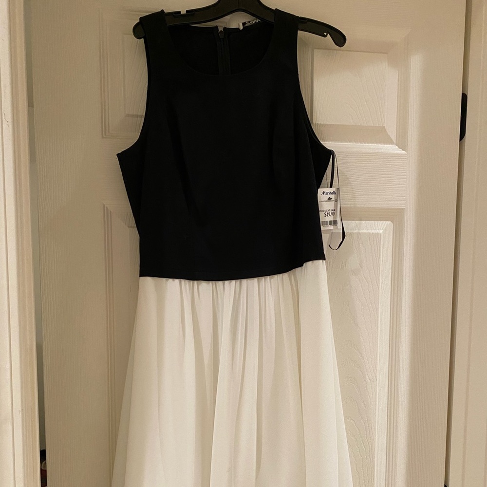 Dress, top 97% cotton & 3% spandex, Bottom 100% polyester with lining. Dry clean
